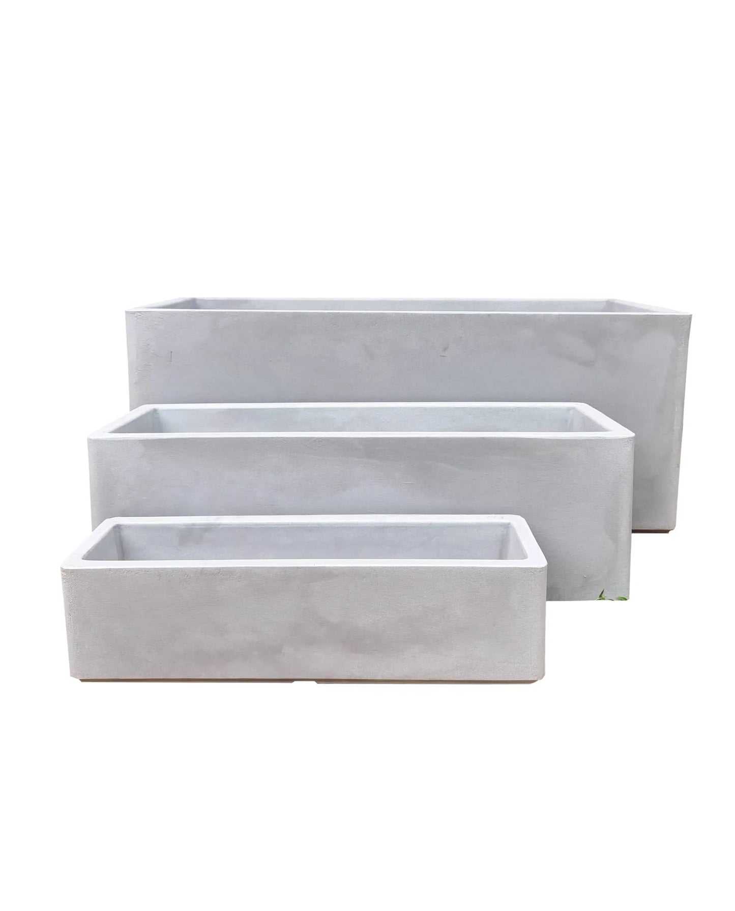 Three Flat Japi Window Box - Double Walled planters by Florastyle By Hingham, in different sizes, are stacked step-like against a white background.