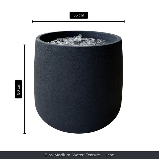 A black, cylindrical indoor-outdoor fountain with a bubbling top, 55 cm wide and 50 cm high—ideal as a striking water feature or elegant garden decor. Text: Water Feature - Bios Medium by Florastyle By Hingham. Made from polyresin, durable and waterproof, yet lightweight. Suitable for indoor and outdoor spaces.
Colour: Lead
Price: R4465