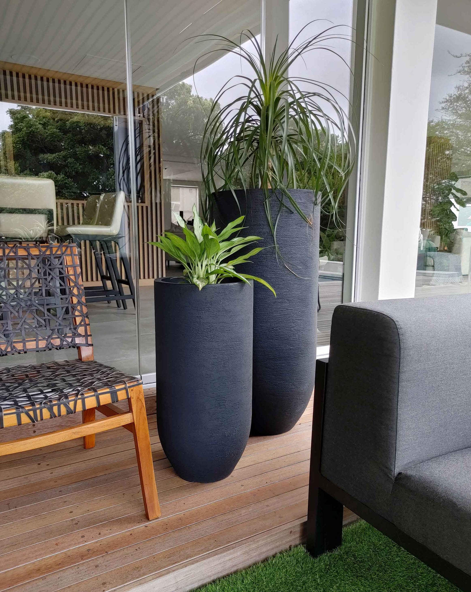 Tall sleek and elegant. A statement planter by Japi that adds an extra layer of décor interest, bringing height&nbsp;into your architectural space. Beautiful textured finish. Florastyle by Hingham.