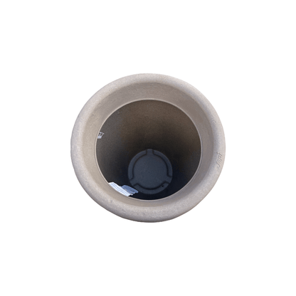 Top-down view of an empty, round Antique Japi Planter by Florastyle By Hingham, featuring a beige stone look, smooth rim, and visible tag inside, set against a white background.