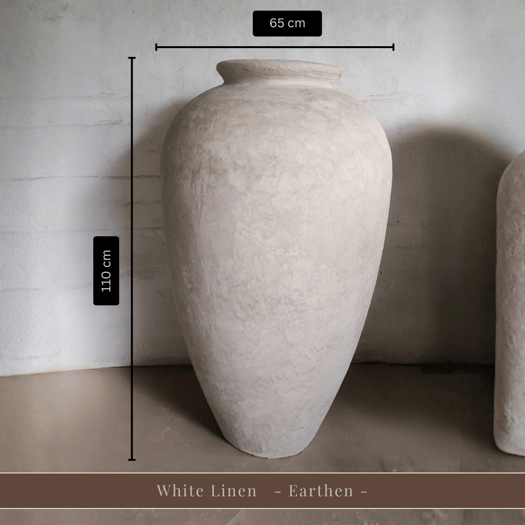 Large, lightweight "Rhodes Organic Fiberglass Pot - Earth Range" by Florastyle By Hingham. 110 cm tall, 65 cm wide, with a smooth light beige finish. Displayed indoors against a textured white wall.