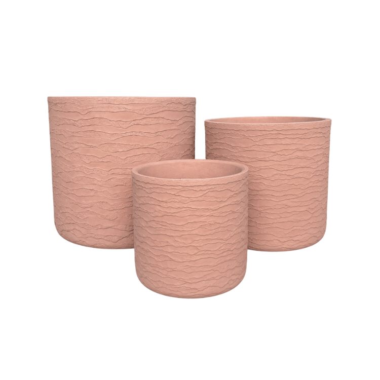 Three round, textured Japi Delhi Planter pots by Florastyle By Hingham in light pink and assorted sizes are displayed together on a white background, adding modern charm as indoor or outdoor planters for any space.