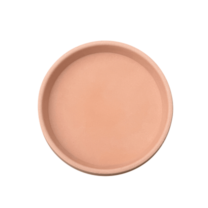 A Round Saucer (Drip tray) by Florastyle By Hingham, terracotta-colored and shallow, is shown from above on a white background—perfect for placing under your favorite Japi planter with drainage holes.