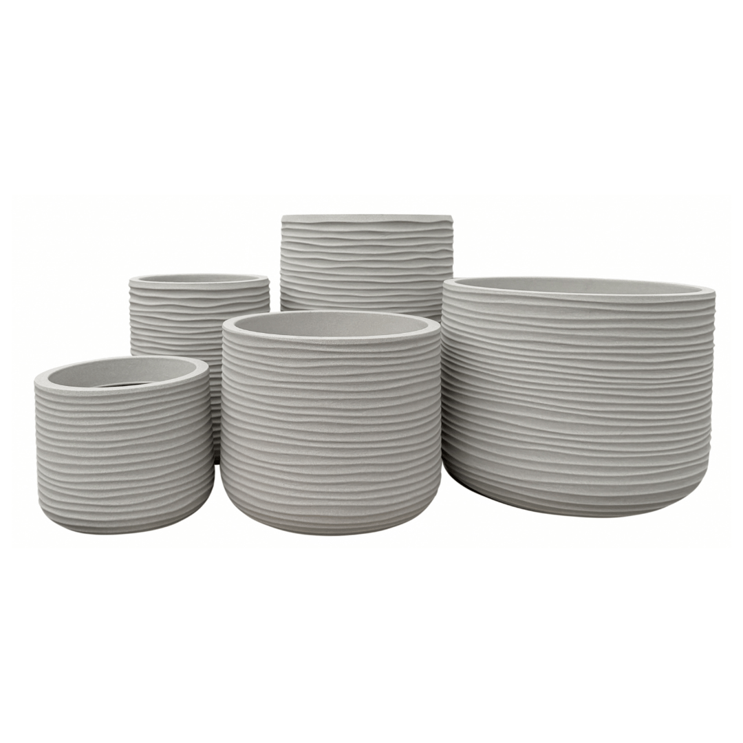 Five round, light gray Lagoon Round Japi Planters by Florastyle By Hingham of varying sizes, featuring horizontal ribbed textures, are grouped together against a white background. These modern polyresin planters offer a perfect blend of contemporary design and long-lasting durability.