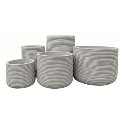Five round, light gray Lagoon Round Japi Planters by Florastyle By Hingham of varying sizes, featuring horizontal ribbed textures, are grouped together against a white background. These modern polyresin planters offer a perfect blend of contemporary design and long-lasting durability.