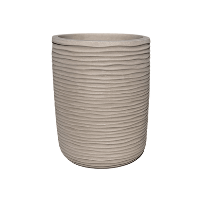 The Florastyle By Hingham Lagoon Tall Japi Planter is a large, round, beige modern planter with a ribbed horizontal texture. Made from lightweight polyresin, it is shown empty against a plain white background.
