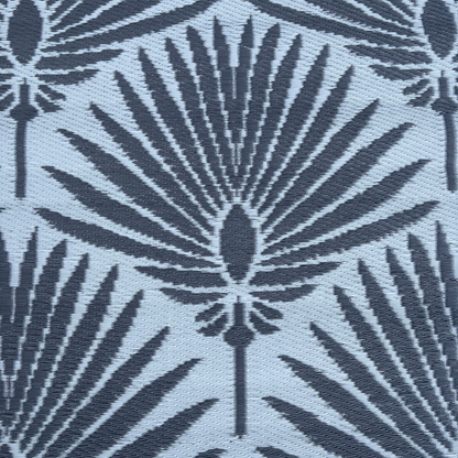 The Florastyle By Hingham Medium Mumbai Outdoor Reversible Mat features lightweight, double-woven construction and water resistance, with a dark gray geometric palm leaf pattern on a light gray background in an Art Deco style.