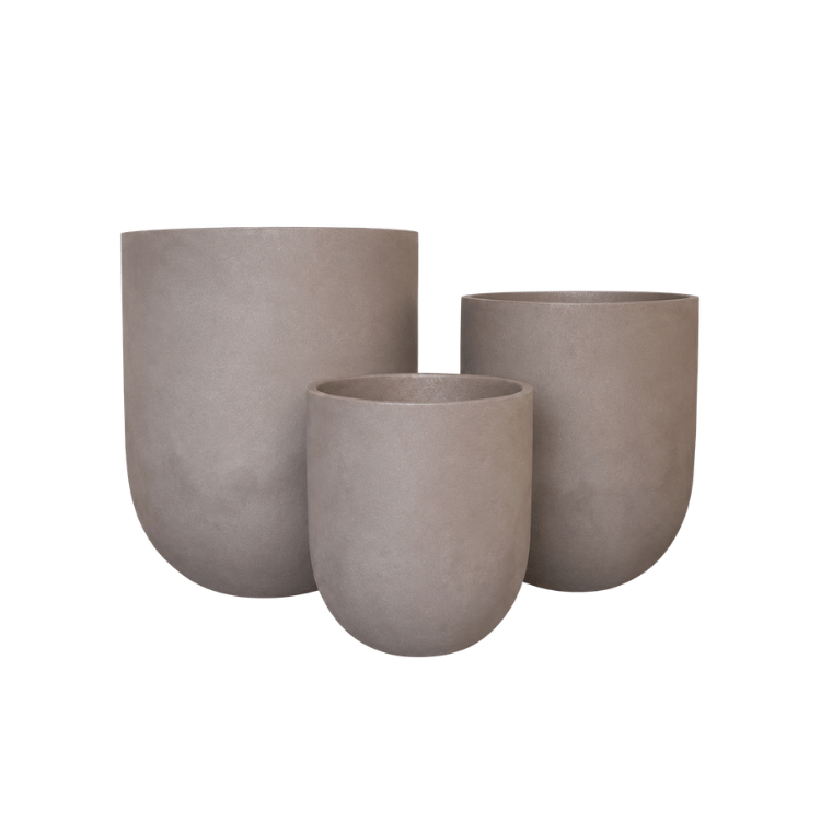 Three minimalist, light brown Traditional Cask Japi Planters by Florastyle By Hingham in varying heights and sizes are grouped together against a white background.