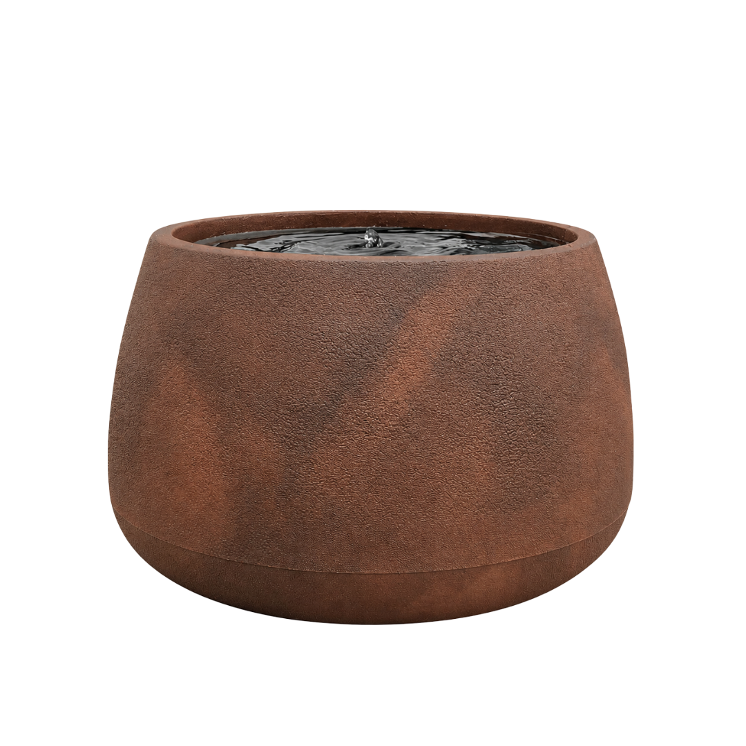 The Water Feature - Bios Low by Florastyle By Hingham is a round, textured brown modern planter with gently sloping sides, filled with water and a small central fountain, shown isolated on a white background.