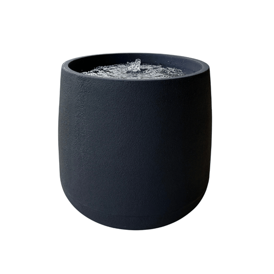 The Florastyle By Hingham "Water Feature - Bios Medium" is a modern, round black tabletop fountain with central bubbling water—an elegant indoor or outdoor decor piece, shown isolated on a white background. Made from polyresin, durable and waterproof, yet lightweight. Suitable for indoor and outdoor spaces.
Colour: Lead
Price: R4465