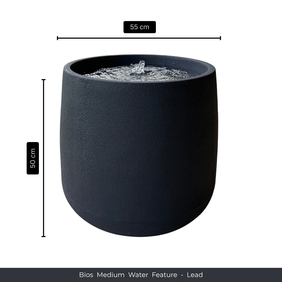 A black, cylindrical indoor-outdoor fountain with a bubbling top, 55 cm wide and 50 cm high—ideal as a striking water feature or elegant garden decor. Text: Water Feature - Bios Medium by Florastyle By Hingham. Made from polyresin, durable and waterproof, yet lightweight. Suitable for indoor and outdoor spaces.
Colour: Lead
Price: R4465