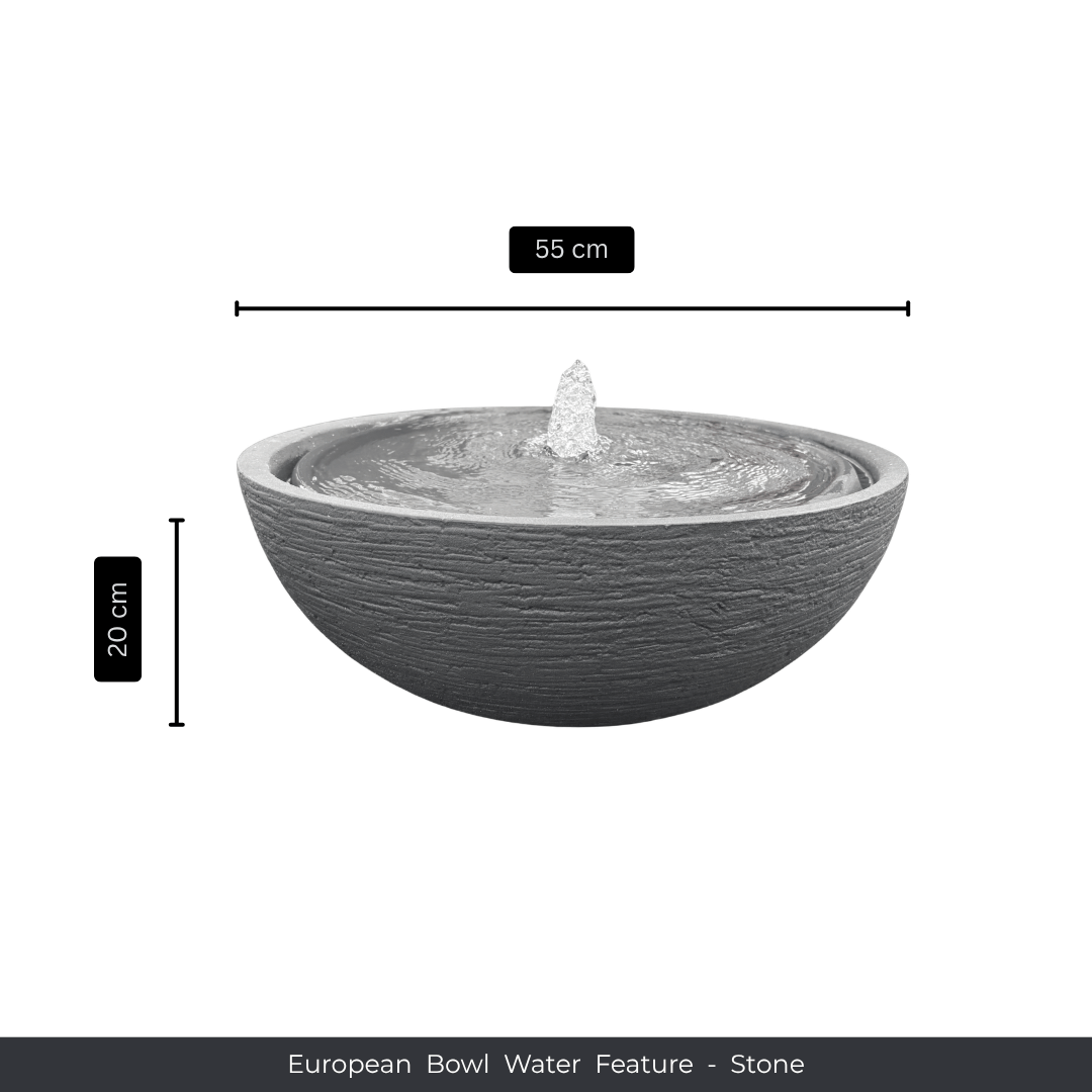 A round, stone-textured bowl planter water feature with a small fountain in the center. Measures 55 cm wide and 20 cm tall. Text below reads: Water Feature - European Bowl Medium, Florastyle By Hingham. Made from polyresin, durable and waterproof, yet lightweight. Suitable for indoor and outdoor spaces.
Colour: Stone
Price: R2995