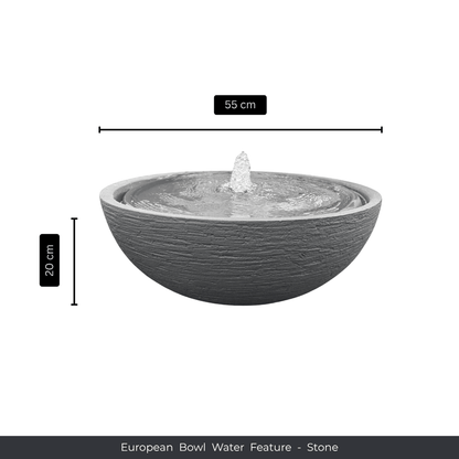 A round, stone-textured bowl planter water feature with a small fountain in the center. Measures 55 cm wide and 20 cm tall. Text below reads: Water Feature - European Bowl Medium, Florastyle By Hingham. Made from polyresin, durable and waterproof, yet lightweight. Suitable for indoor and outdoor spaces.
Colour: Stone
Price: R2995