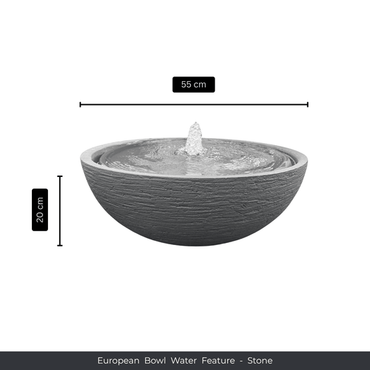 A round, stone-textured bowl planter water feature with a small fountain in the center. Measures 55 cm wide and 20 cm tall. Text below reads: Water Feature - European Bowl Medium, Florastyle By Hingham. Made from polyresin, durable and waterproof, yet lightweight. Suitable for indoor and outdoor spaces.
Colour: Stone
Price: R2995
