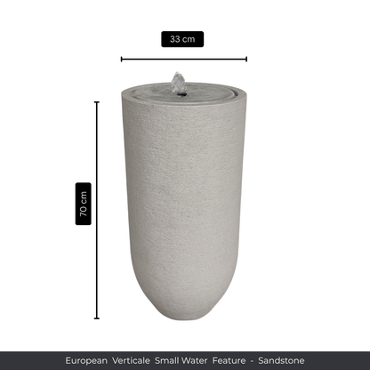 A tall, cylindrical sandstone water fountain by Florastyle By Hingham, 70 cm high and 33 cm in diameter. Text below: Water Feature - European Verticale Small. Made from polyresin, durable and waterproof, yet lightweight. Suitable for indoor and outdoor spaces.
Colour Sandstone
Price: R3465