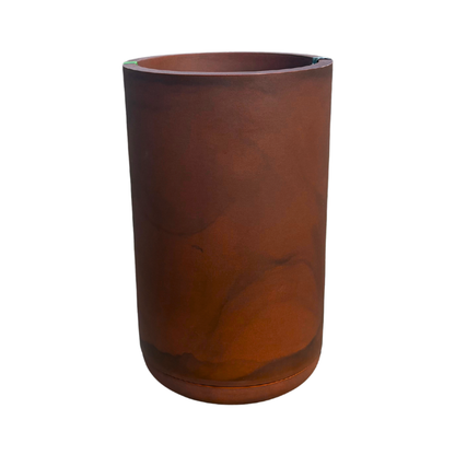 The Florastyle By Hingham Match Cylinder Japi Planter With Saucer is an extra large, tall, cylindrical planter in reddish-brown with a smooth matte finish and subtle marbling, shown against a plain white background.