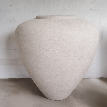 The Mykonos Organic Fiberglass Pot - Earth Range by Florastyle By Hingham features a large, textured off-white design with a wide body and narrow base, offering sculptural décor and a rustic finish inspired by Mykonos planters.