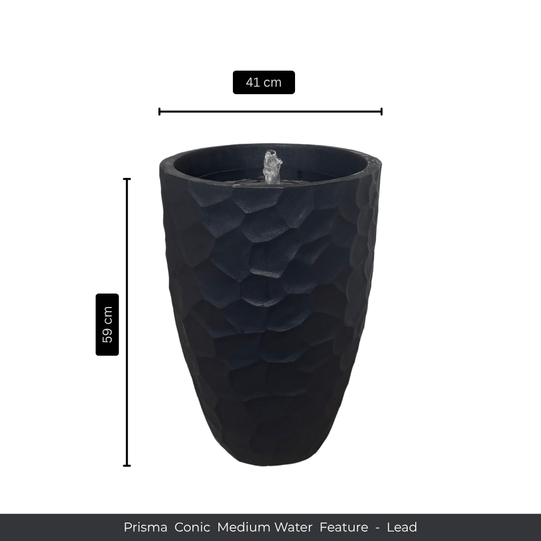 The Florastyle By Hingham Water Feature - Prisma Conic Medium is a tall, textured black (Lead) polyresin fountain with a small top fountain. Measures 59 cm high and 41 cm diameter. The colour is "Lead". Made from polyresin, durable and waterproof, yet lightweight. Suitable for indoor and outdoor.
Colour: Lead
Price: R3095