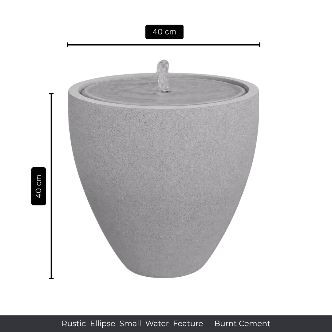 The Water Feature - Rustic Ellipse Small by Florastyle By Hingham is a grey, burnt cement, ellipse-shaped piece (40 cm high/wide) with a central spout—ideal for adding rustic charm to any indoor or outdoor space.