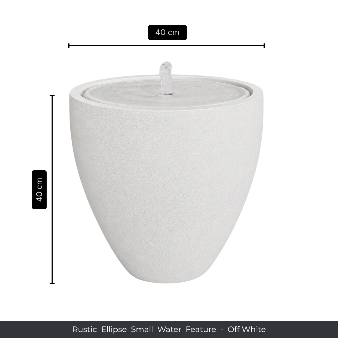 The Florastyle By Hingham Water Feature - Rustic Ellipse Small is an off-white, ellipse-shaped fountain (40x40cm) that adds tranquil charm indoors or outdoors with its central spout and rustic design.