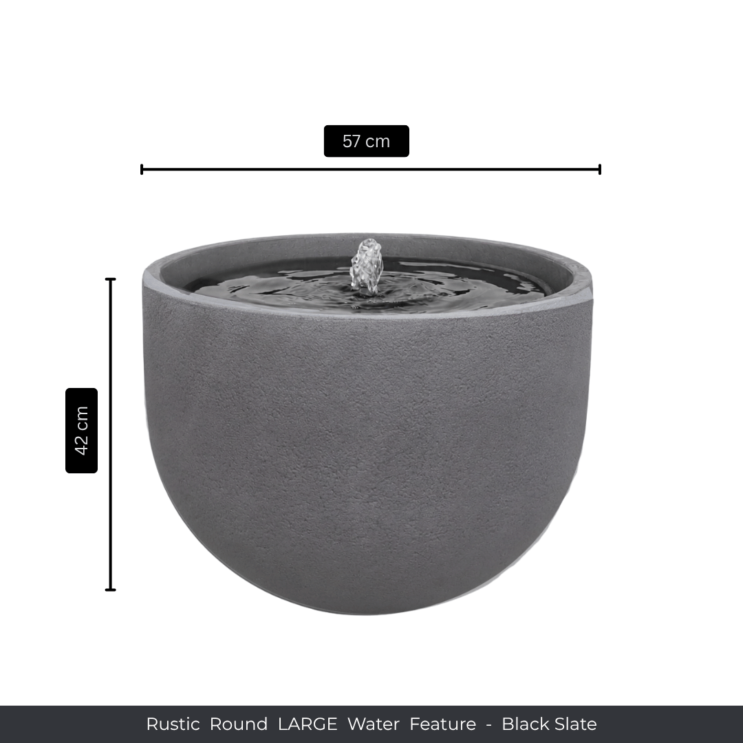 The Florastyle By Hingham Water Feature - Rustic Round is a large, round black slate patio fountain, 57 cm wide and 42 cm tall. It’s UV-resistant, with a small central fountain that adds rustic charm to any garden space. Made from polyresin, durable and waterproof, yet lightweight. Suitable for indoor and outdoor spaces.
Colour: Black Slate
Price: R3625
