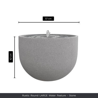 A round, stone water feature by Florastyle By Hingham with a central fountain. Measures 57 cm wide x 42 cm tall. Rustic texture adds charm. Text below reads: Water Feature - Rustic Round by Florastyle By Hingham. Made from polyresin, durable and waterproof, yet lightweight. Suitable for indoor and outdoor spaces.
Colour: Stone
Price: R3625