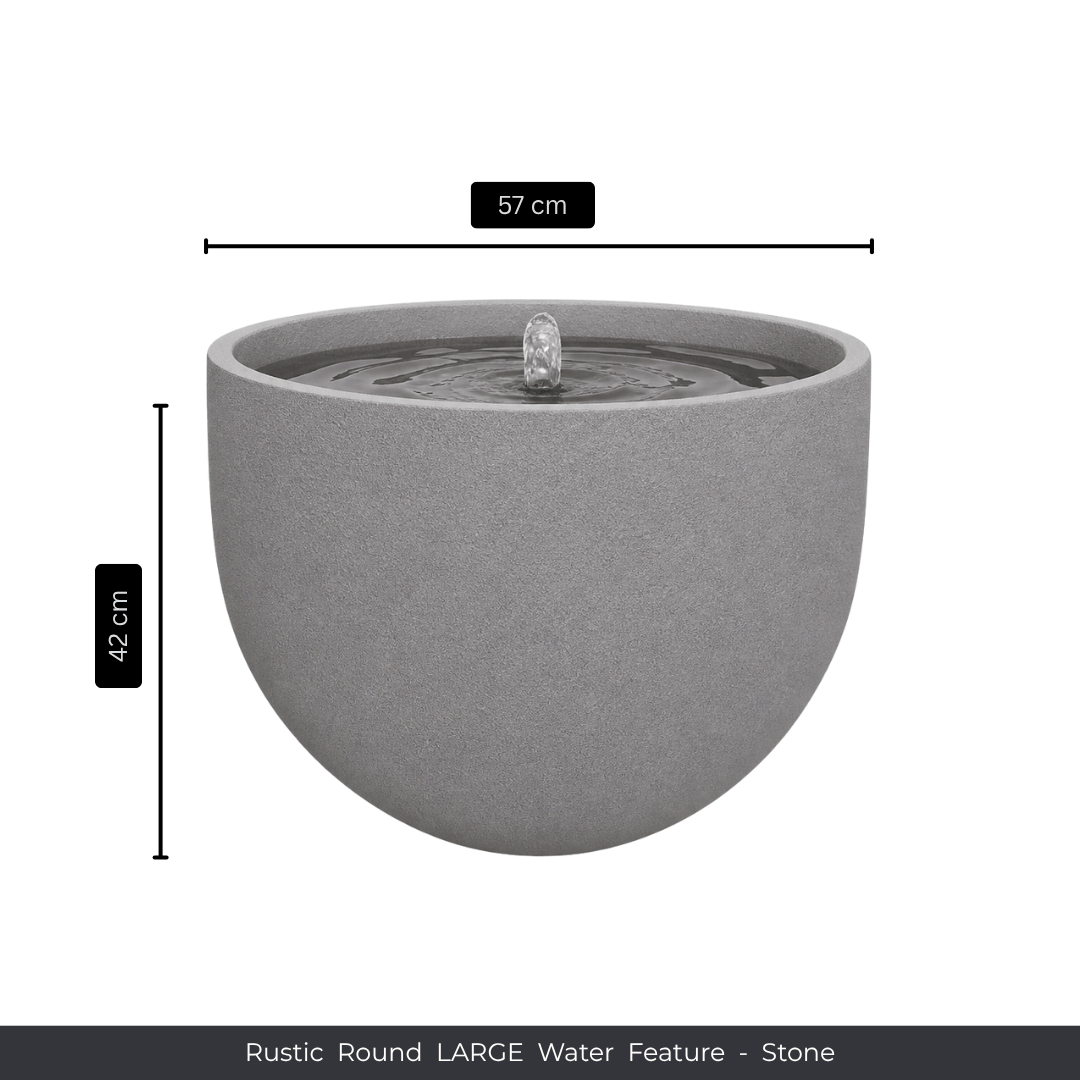 The Florastyle By Hingham Water Feature - Rustic Round is a large, round gray outdoor fountain with a central spout, made from UV-resistant polyresin. It measures 57 cm wide and 42 cm tall. "Rustic Round LARGE Water Feature - Stone" appears below. Made from polyresin, durable and waterproof, yet lightweight. Suitable for indoor and outdoor spaces.
Colour: Stone
Price: R3625