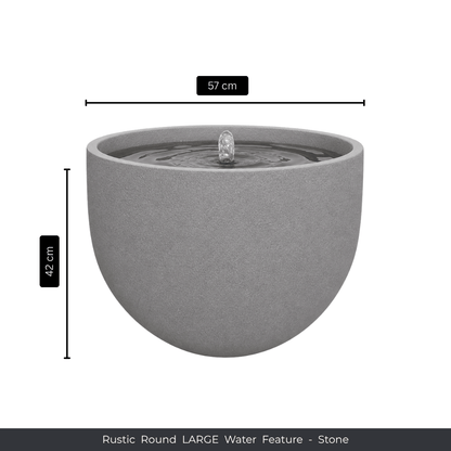 The Florastyle By Hingham Water Feature - Rustic Round is a large, round gray outdoor fountain with a central spout, made from UV-resistant polyresin. It measures 57 cm wide and 42 cm tall. "Rustic Round LARGE Water Feature - Stone" appears below. Made from polyresin, durable and waterproof, yet lightweight. Suitable for indoor and outdoor spaces.
Colour: Stone
Price: R3625