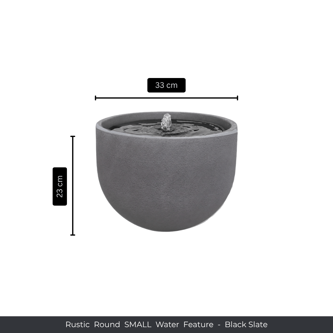 The Florastyle By Hingham Water Feature - Rustic Round is a compact, black slate piece with a smooth finish and central spout, measuring 33 cm wide by 23 cm tall—a charming addition beside polyresin planters. Text: Rustic Round SMALL Water Feature - Black Slate. Made from polyresin, durable and waterproof, yet lightweight. Suitable for indoor and outdoor spaces.
Colour: Black Slate
Price: R1495