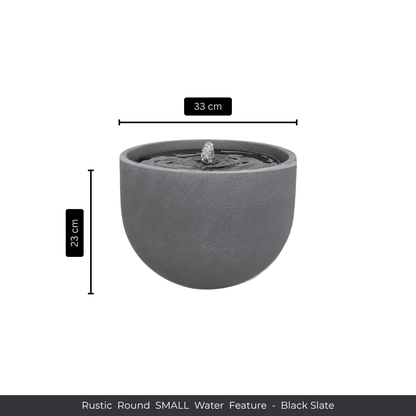 The Florastyle By Hingham Water Feature - Rustic Round is a compact, black slate piece with a smooth finish and central spout, measuring 33 cm wide by 23 cm tall—a charming addition beside polyresin planters. Text: Rustic Round SMALL Water Feature - Black Slate. Made from polyresin, durable and waterproof, yet lightweight. Suitable for indoor and outdoor spaces.
Colour: Black Slate
Price: R1495