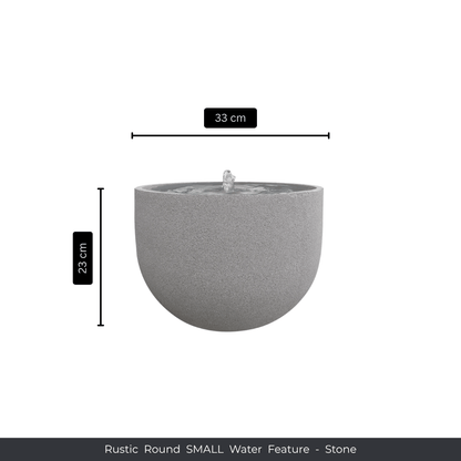 The Florastyle By Hingham Water Feature - Rustic Round is a small, round garden fountain (33 cm wide x 23 cm high) with water bubbling from the center, shown on a white background with product details underneath. Made from polyresin, durable and waterproof, yet lightweight. Suitable for indoor and outdoor spaces.
Colour: Stone
Price: R1495