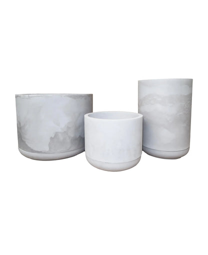 Sophisticated, modern and elegant.  Cylindrical,. Beautiful smooth finish.  Minimalist. Includes drip tray,