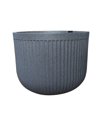 Side view of the planter showing off the unique fluted design in colour Charcoal. Florastyle by Hingham.