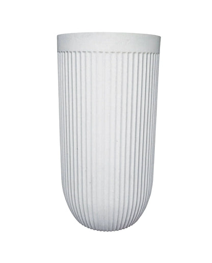 Side view of the tall and elegant planter showing off the unique fluted design in the colour off-white