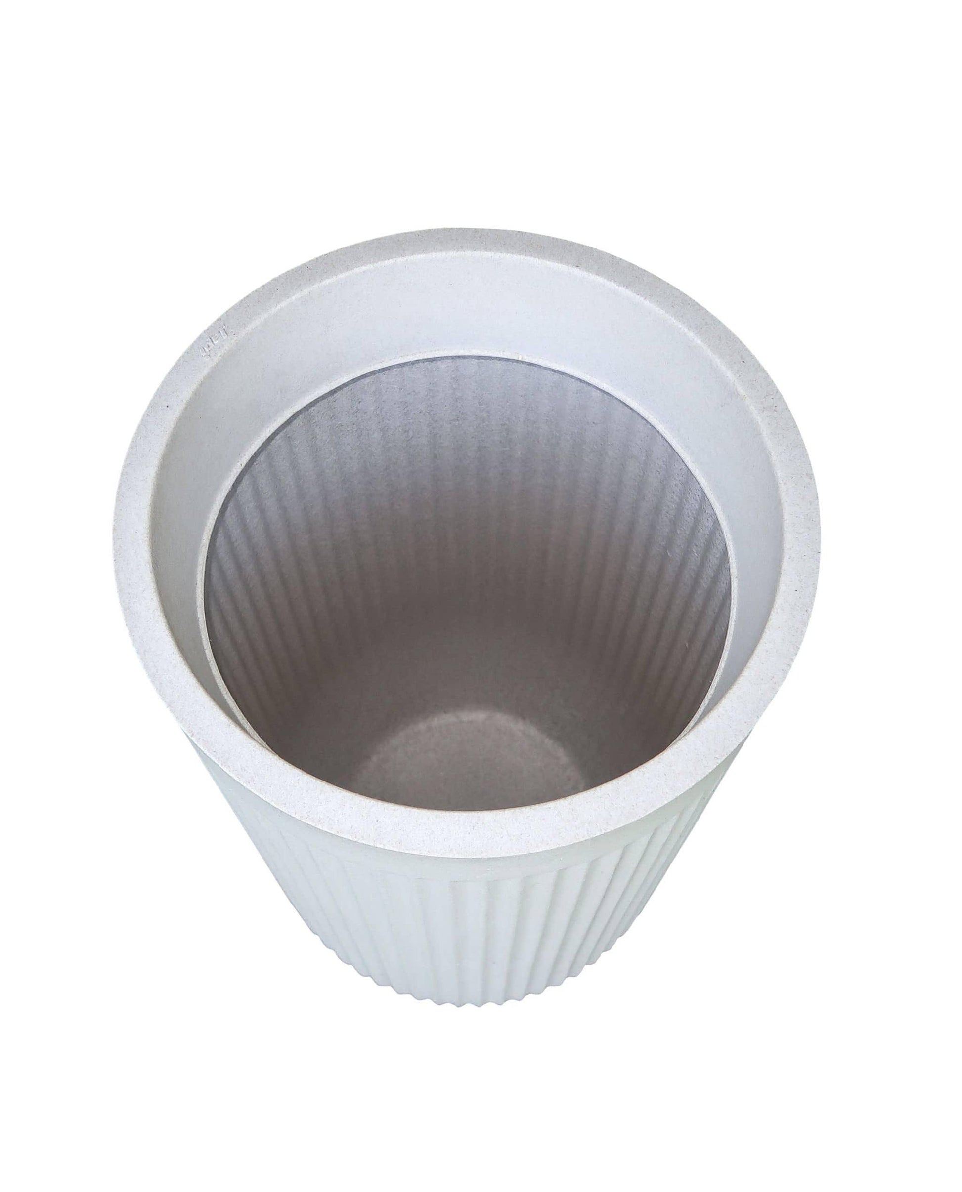 Aerial view into the tall flute planter by Japi showing the depth and the inside rim in the colour off white