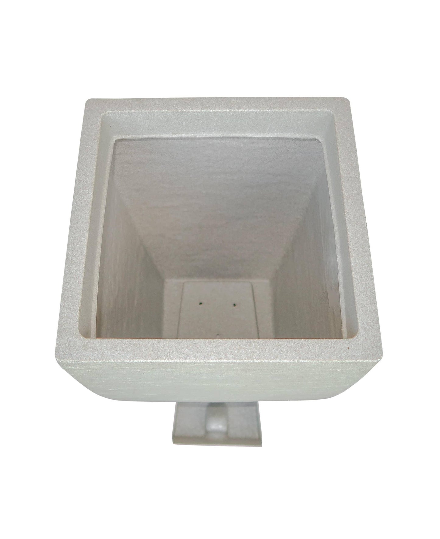 Aerial view showing the drip tray housing and the drip tray in a slide out position outside of the planter.