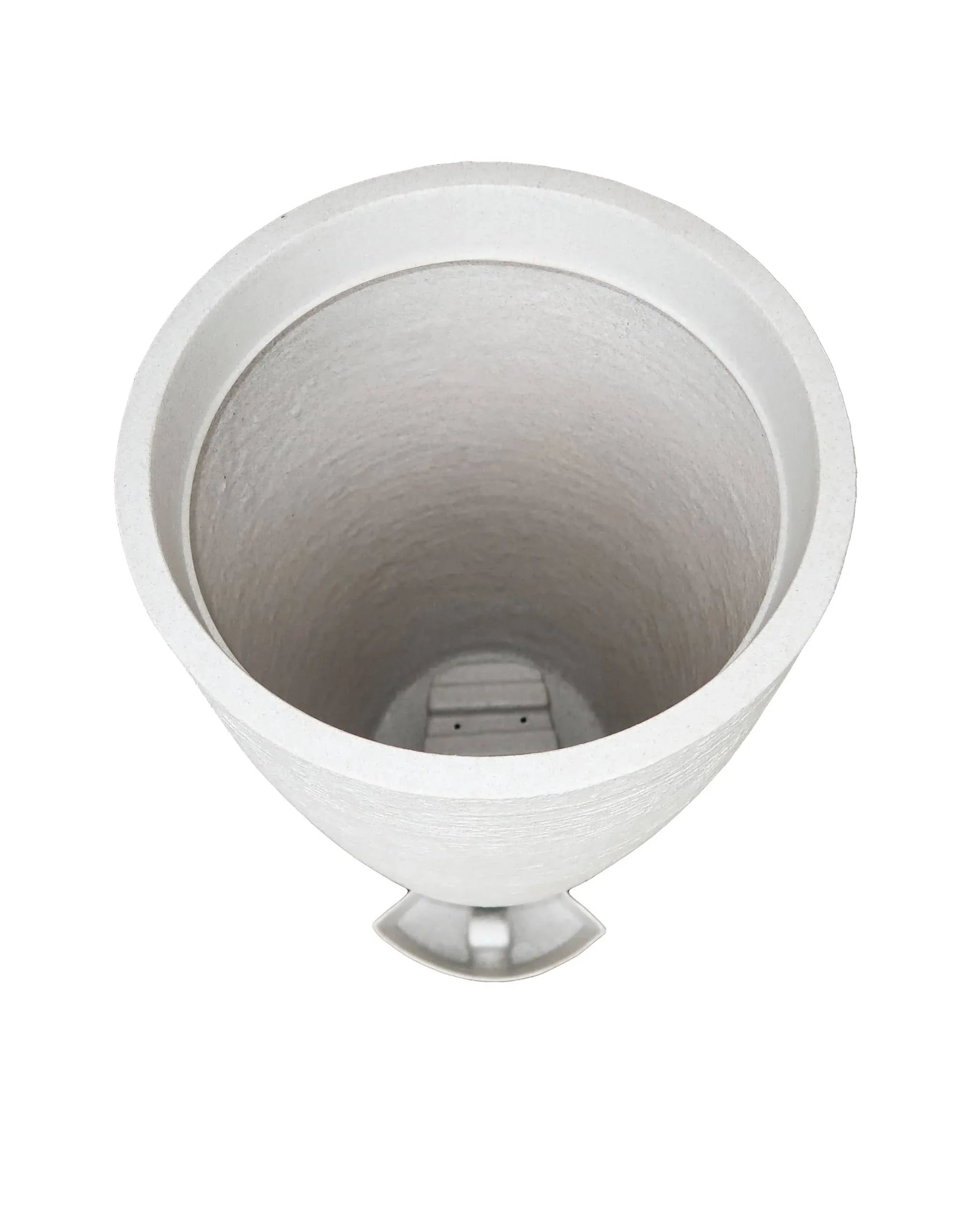 Aerial view showing the drip tray housing and the drip tray in a slide out position outside of the planter.