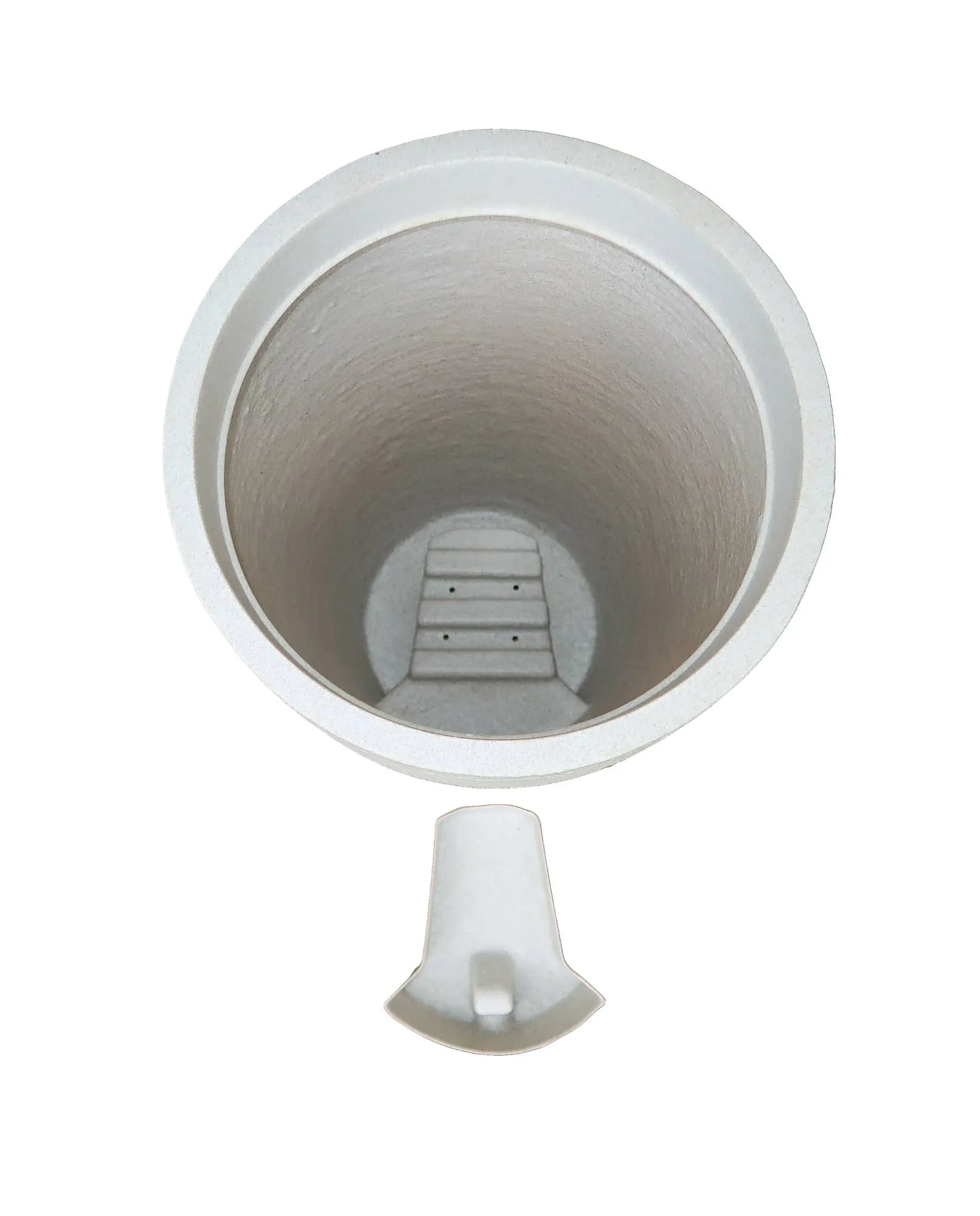 Aerial view showing the drip tray housing and the drip tray in a slide out position outside of the planter.