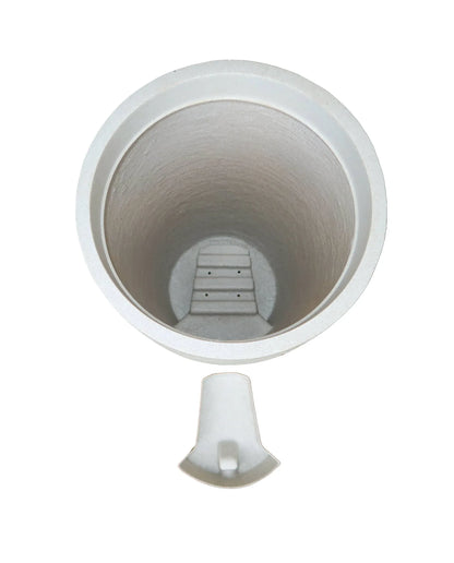 Aerial view showing the drip tray housing and the drip tray in a slide out position outside of the planter.