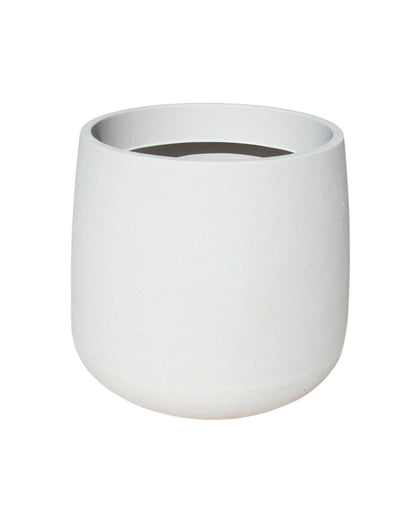 Slight angled view of the medium bios planter, showing the inside rim of the planter and the beautiful slightly textured finish. Colour off-white.