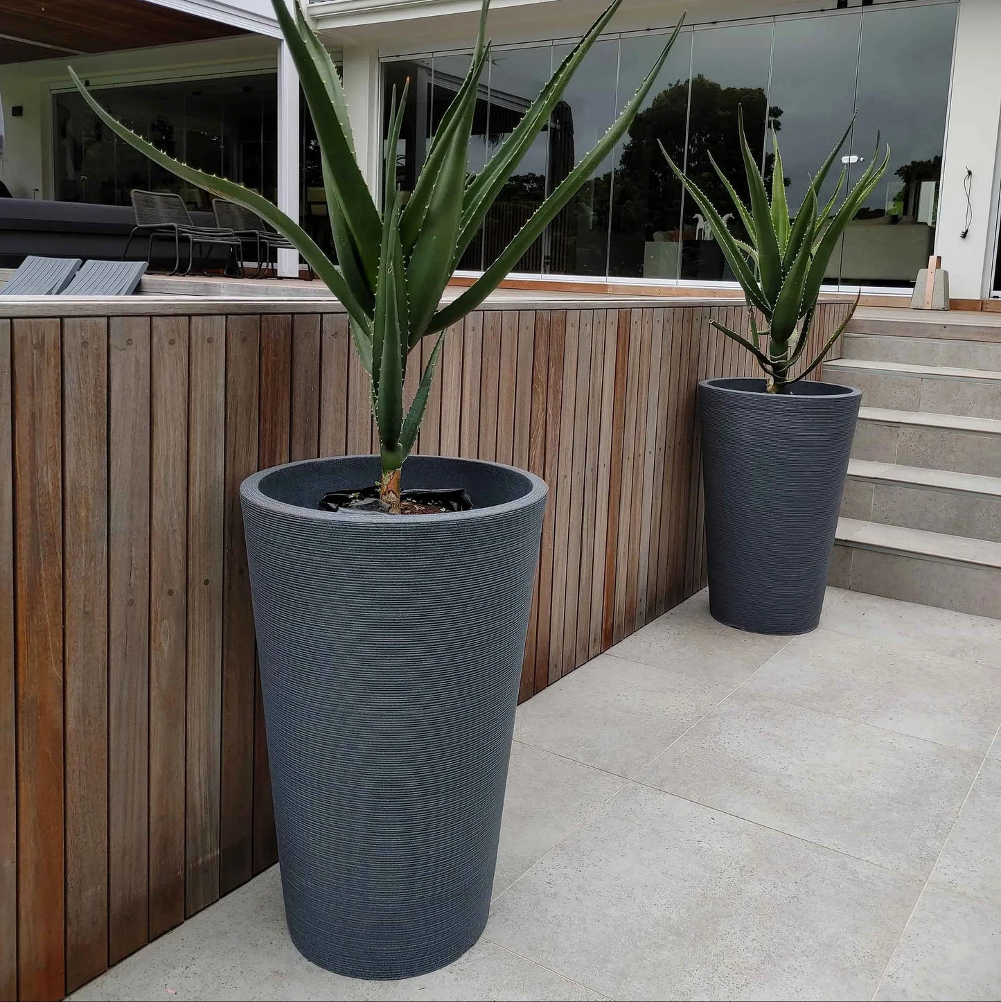 Showcase photograph of the Linear Japi Planter in a modern home outdoor environment. Eye catching Stylish linear design..