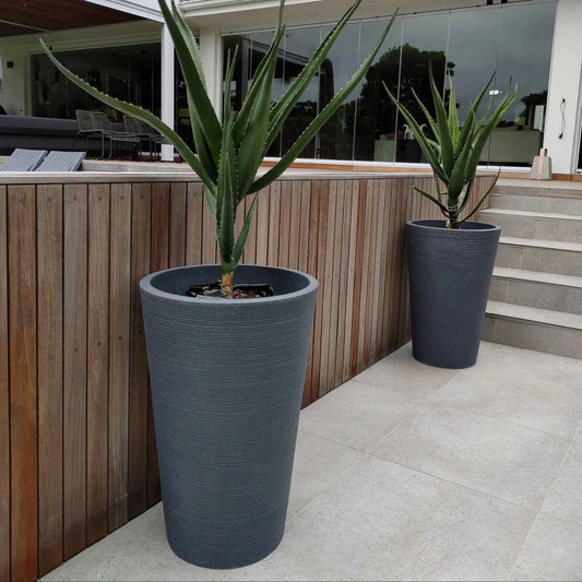 Showcase photograph of the Linear Japi Planter in a modern home outdoor environment. Eye catching Stylish linear design..