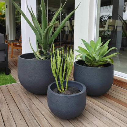 Showcase photograph of the Japi Rustic Round Planter in a modern setting.